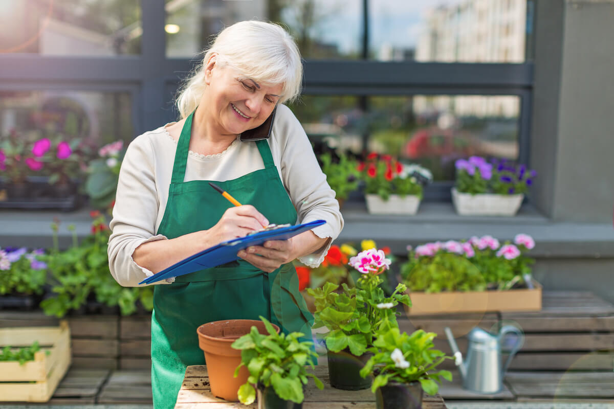 senior woman working at a florist shop_finding purpose after retirement