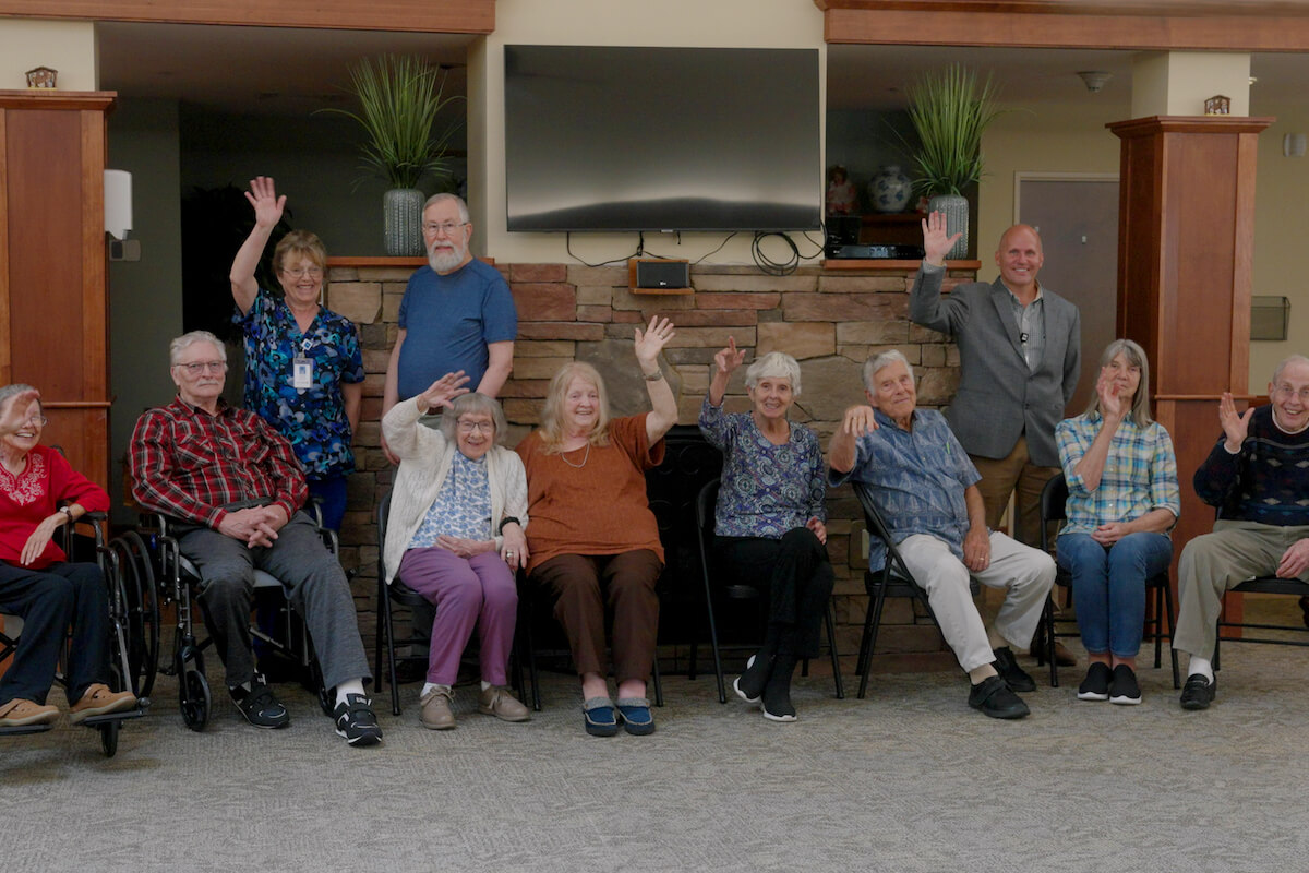 Group of smiling older adults at Uplands Village_Choosing the Right Level of Senior Care