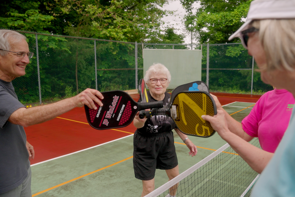 Uplands Village_Seniors with Pickleball Paddles