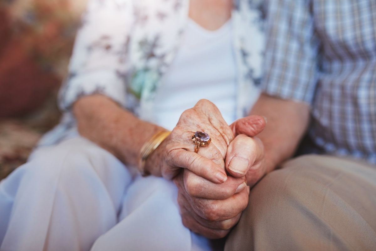 Senior Couple Holding Hands_Uplands Village