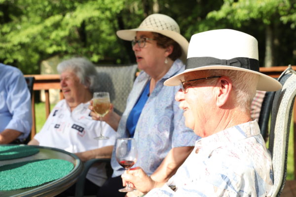 Seniors Socializing and Drinking Wine_Uplands Village