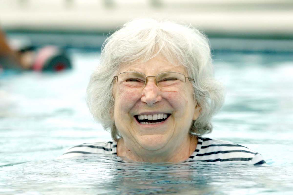 Senior Woman Smiling in Pool_Uplands Village