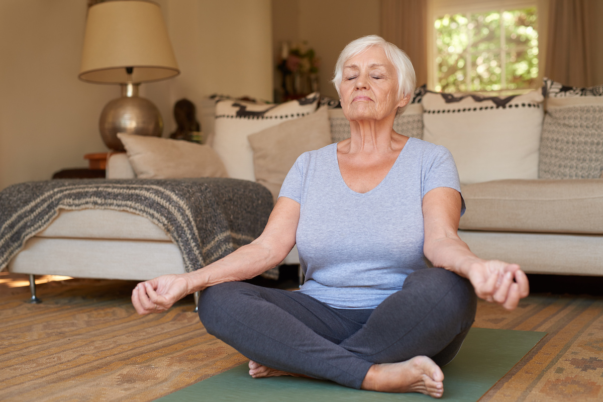 Senior Woman Meditating at Home_Uplands Village