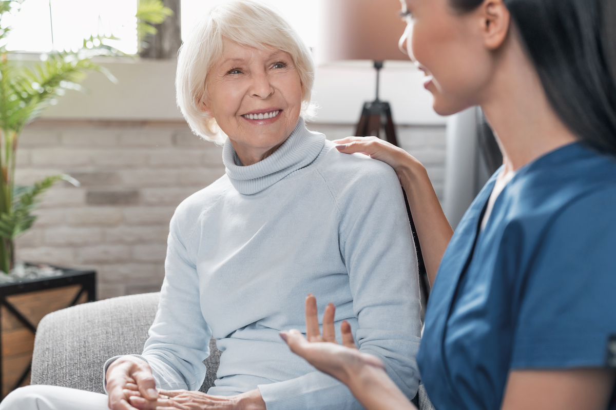 Senior Woman Smiling at Caregiver_Uplands Village