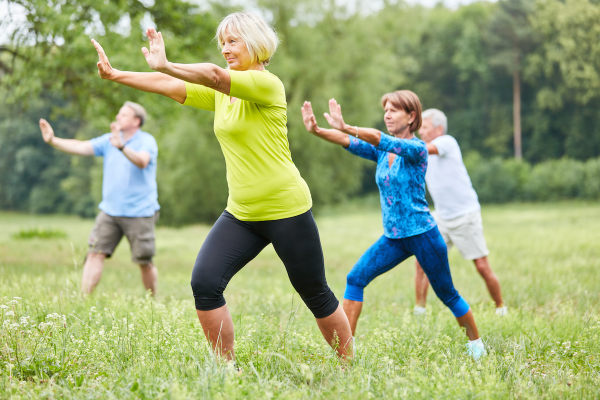 Group of Seniors Doing Tai Chi Outside_Uplands Village